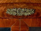 a close up of a drawer with a clock on top of it