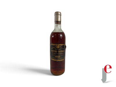 a bottle of whiskey sitting on top of a white surface