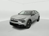 a silver car is parked in a white room with a white floor