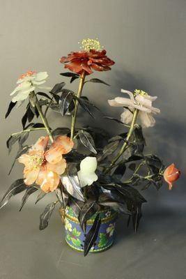 a vase with flowers in it sitting on a table