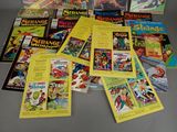 a lot of comic books that are on the table