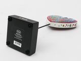a remote control that is connected to a small device