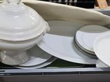 a box with a lot of plates and bowls in it