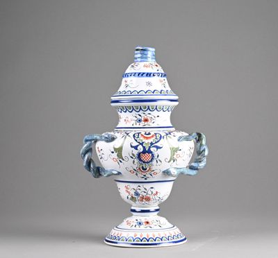 a blue and white vase sitting on a table