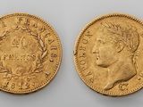 two gold sovereigns, one of which has a bust and the other of which is a bust