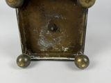 an image of a small metal object with three balls on it