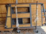 a large wooden structure with a ladder and a window