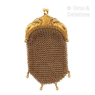 an image of a gold purse with a chain around it