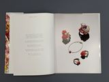 an open book with a picture of jewelry on it