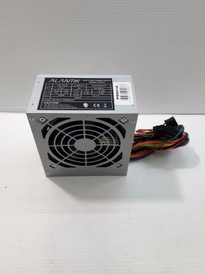 a computer power supply unit on a white surface