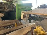 several pieces of wood are stacked on top of each other in a warehouse