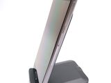 a cell phone that is sitting on top of a stand