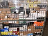 a metal cart with many boxes on it in a warehouse