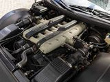 a car engine with the hood open on the street