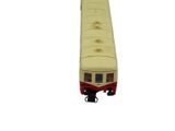 a yellow and red train car on a white background