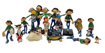 many figurines of different characters on a white background
