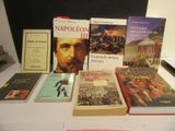 many books that are on a table together
