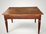 an old wooden table with two legs and a wooden top
