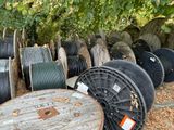 many spools of different sizes and colors on the ground