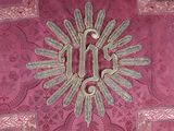 a picture of a decorative design on a pink cloth