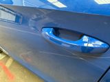 a close up of a car door handle on the side of the car