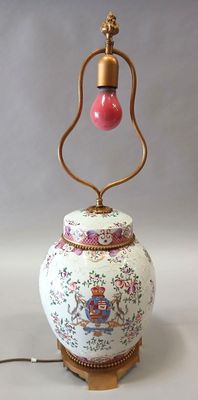 a lamp that is on a stand with a light on top of it