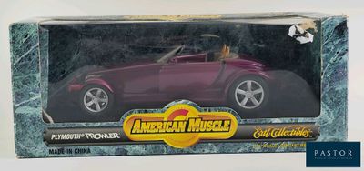 an image of a purple toy car in a box on a white surface