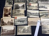 a lot of old postcards that are on a table