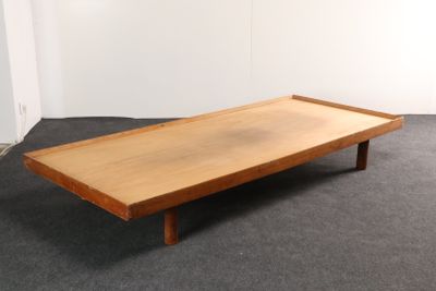 an image of a wooden coffee table on a carpeted floor