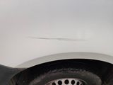 a close up of a car ' s tire on the street