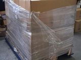a large cardboard box sitting on a pallet in a warehouse