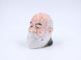 a figurine of an old man with a beard