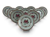 six plates with floral designs on them on a white surface
