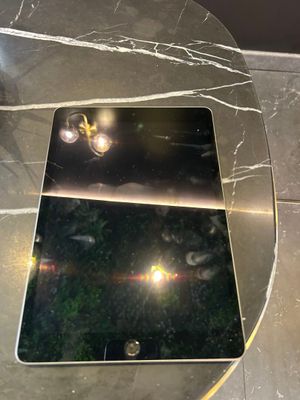 a glass table with a laptop on top of it