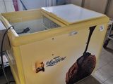 an ice cream machine that is sitting on the floor