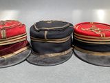four hats are lined up in a row on a table