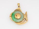 an image of a gold and green pendant with a fish on it
