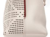 leather handbag with perforsants and red handles on a white background