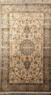 a beige and black rug on a wooden floor