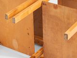 two pieces of wood are stacked on top of each other