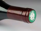 a close up of a bottle of wine on a table