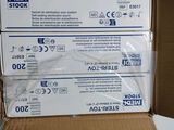 two boxes of medical supplies are stacked on top of each other