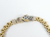 an image of a gold bracelet with a blue and white diamond clasp