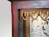 a clock that is sitting on a shelf in a room