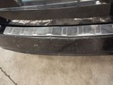 the front bumper of a car with a denting bumper guard