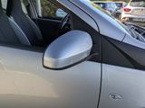 a silver car that is parked in a parking lot