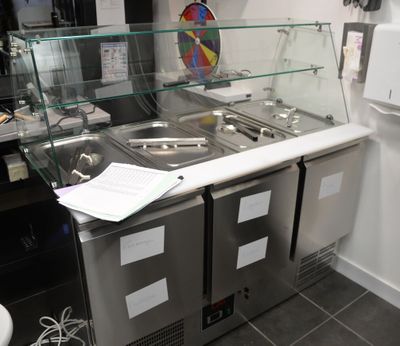 an image of a commercial kitchen with stainless steel counter tops and stainless steel sinks