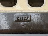 a close up of a metal object with holes in it