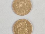 two gold coins with a woman ' s face and a man ' s head on them