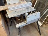 several pieces of wood are stacked on top of a workbench